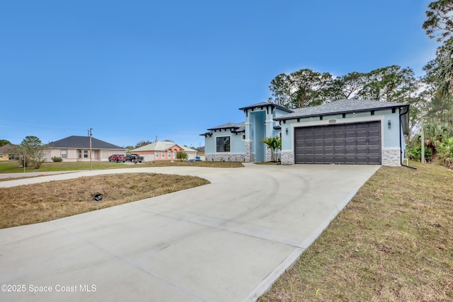 view of front facade with a garage and a front yard