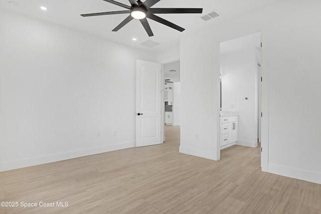 unfurnished bedroom featuring ceiling fan and light wood-type flooring