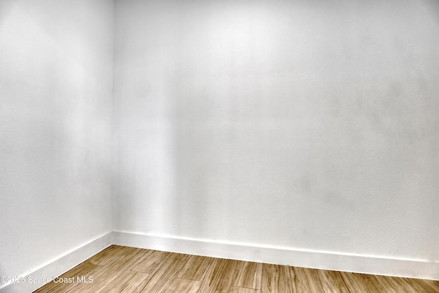 empty room featuring hardwood / wood-style floors