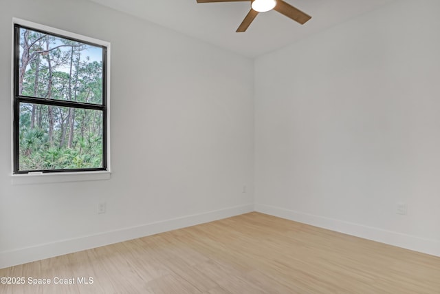 unfurnished room with ceiling fan and wood-type flooring