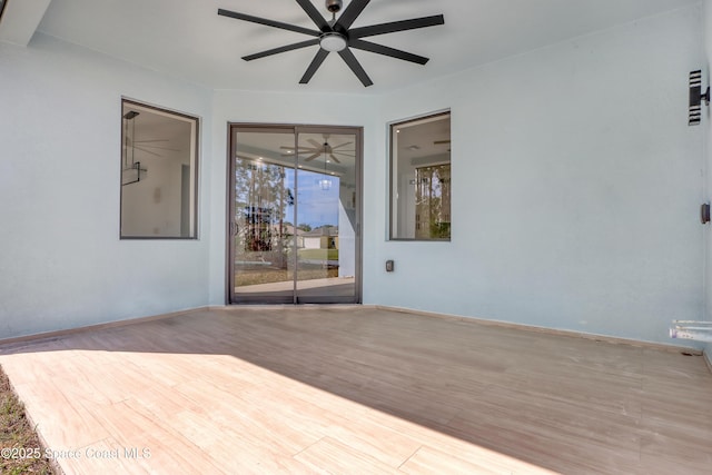 interior space with ceiling fan and light hardwood / wood-style flooring