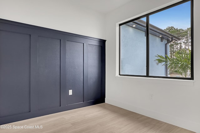 unfurnished bedroom featuring light wood-type flooring