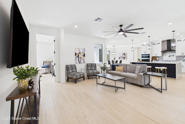 2311 San Filippo Dr SE, Palm Bay, FL 32909 - living area with ceiling fan, visible vents, recessed lighting, and light wood finished floors