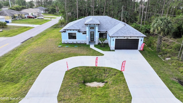2311 San Filippo Dr SE, Palm Bay, FL 32909 - modern inspired farmhouse with a front yard, stucco siding, a garage, and driveway