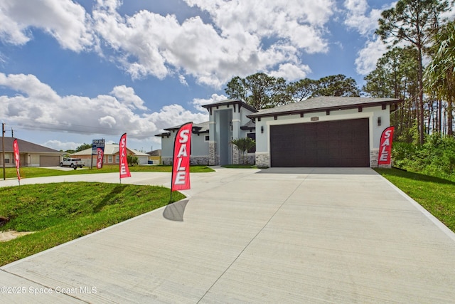 2311 San Filippo Dr SE, Palm Bay, FL 32909 - view of front facade featuring driveway, stucco siding, a front yard, and an attached garage