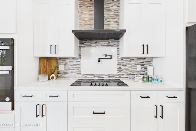2311 San Filippo Dr SE, Palm Bay, FL 32909 - kitchen featuring white cabinetry, black appliances, wall chimney range hood, and light countertops
