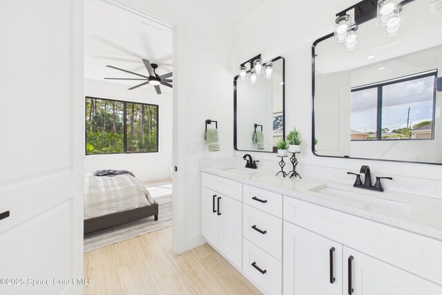 2311 San Filippo Dr SE, Palm Bay, FL 32909 - full bathroom with double vanity, ceiling fan, and a sink