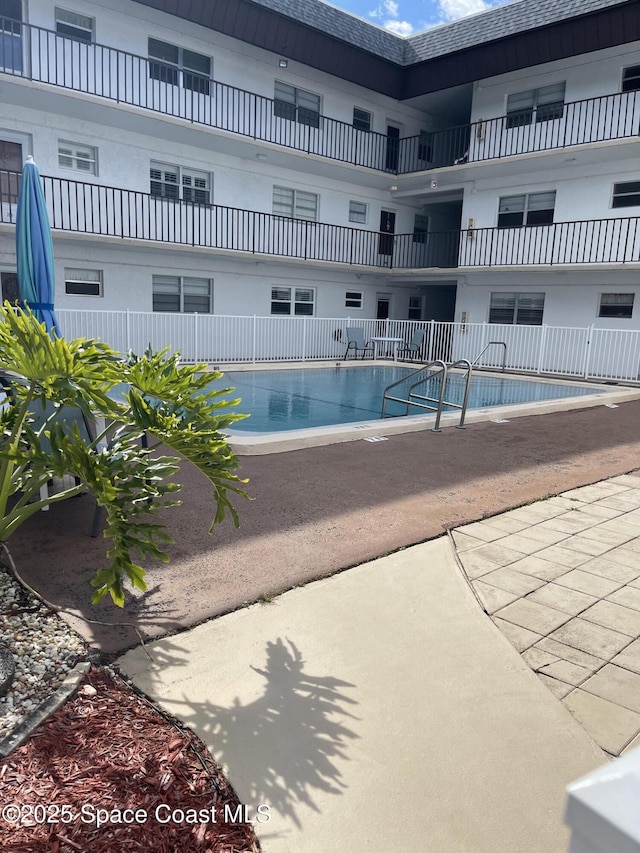 view of swimming pool with a patio