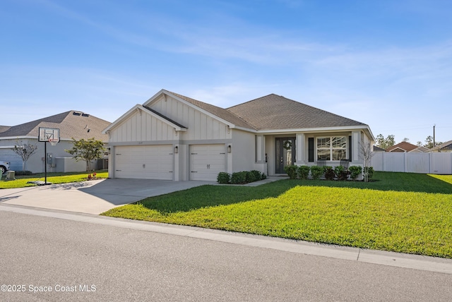 view of front facade with a front yard and a garage