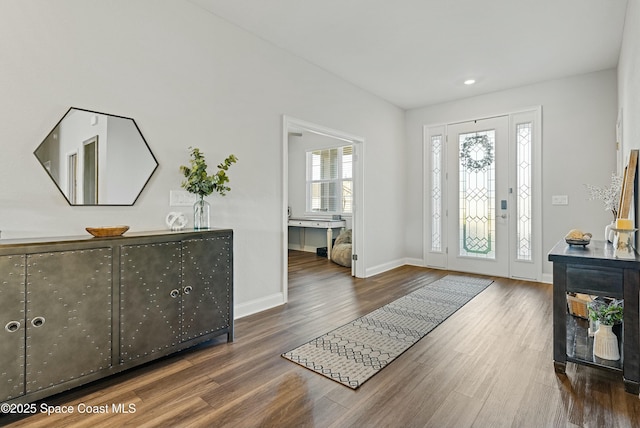 foyer entrance featuring dark hardwood / wood-style floors