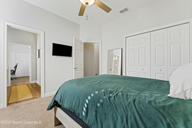 bedroom featuring a closet, ceiling fan, and carpet floors