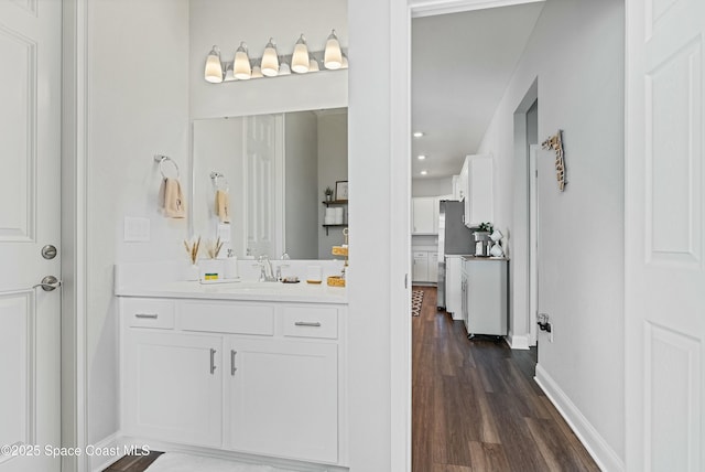 bathroom featuring vanity and hardwood / wood-style floors