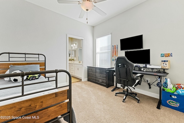 carpeted bedroom featuring ensuite bath and ceiling fan