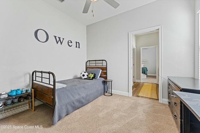 carpeted bedroom featuring ceiling fan