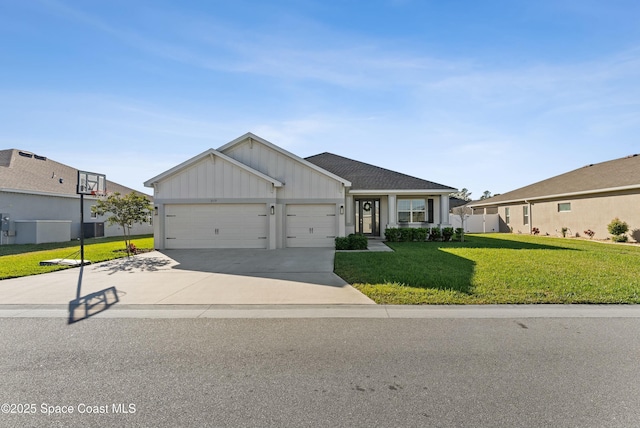 view of front facade with a front yard and a garage