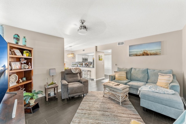 living room featuring ceiling fan