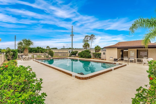 view of pool featuring a patio