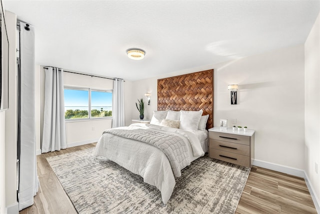 bedroom with light wood-type flooring