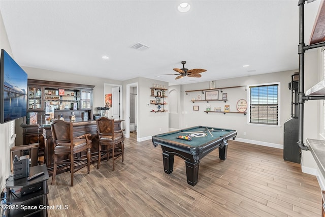 playroom featuring hardwood / wood-style flooring, bar area, ceiling fan, and pool table