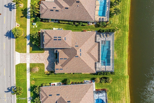 drone / aerial view featuring a water view