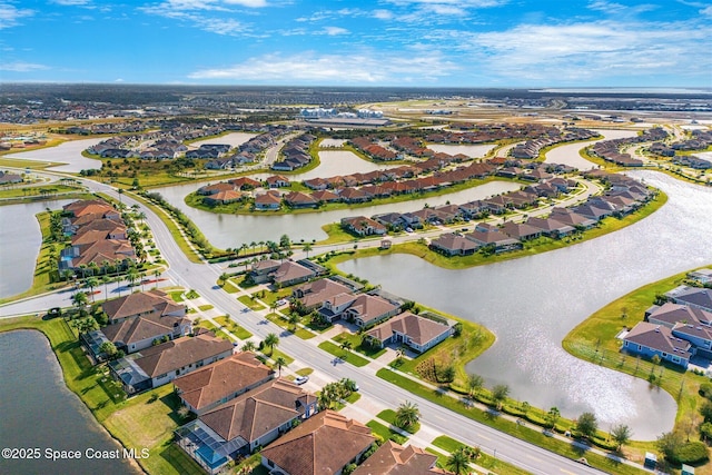 drone / aerial view with a water view