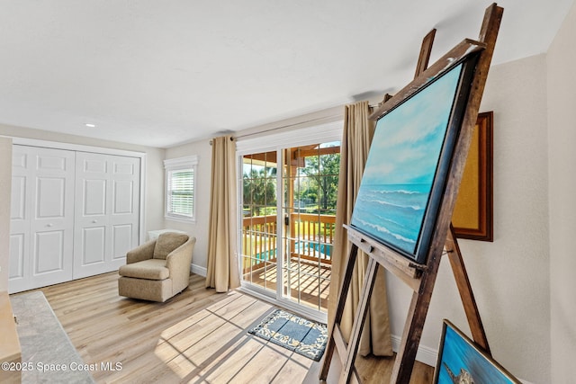 entryway featuring baseboards and wood finished floors