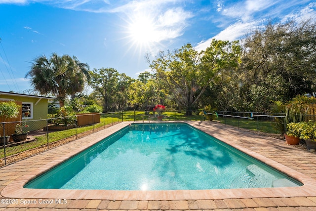 view of swimming pool featuring a fenced in pool and fence