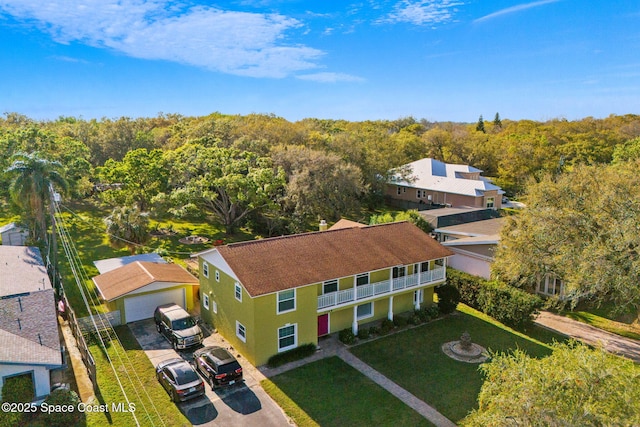 drone / aerial view featuring a view of trees