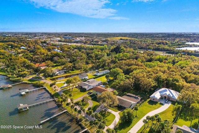 aerial view featuring a water view and a wooded view