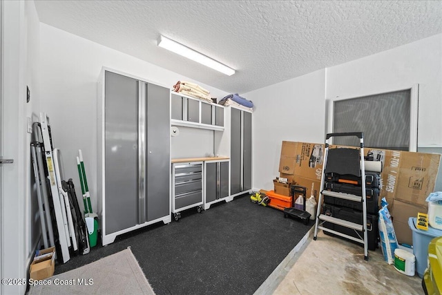 miscellaneous room with a textured ceiling