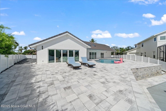 view of swimming pool featuring a patio area