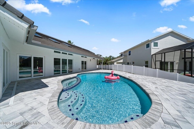 view of pool featuring an in ground hot tub and a patio