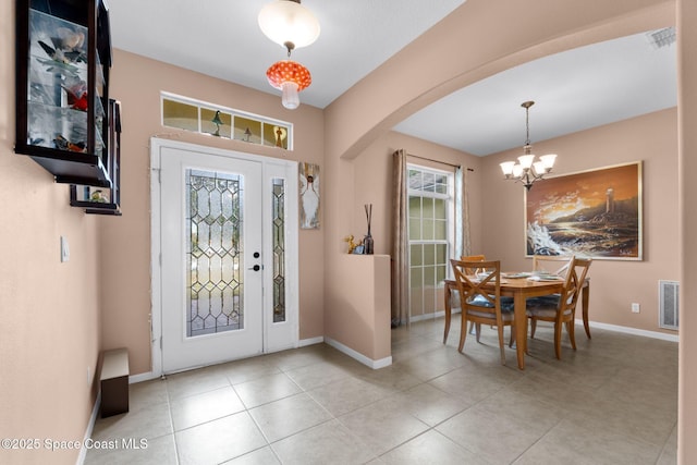 entrance foyer featuring a chandelier