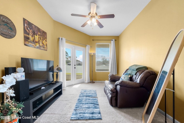 living room featuring french doors, carpet flooring, and ceiling fan