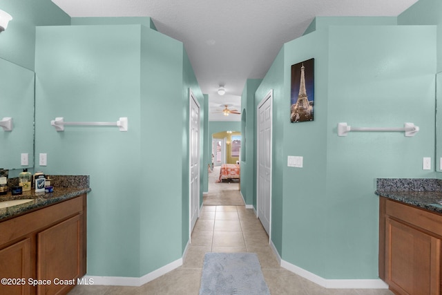 interior space featuring light tile patterned floors and sink