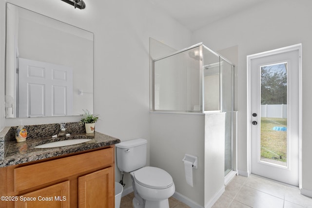 bathroom with an enclosed shower, a wealth of natural light, and vanity