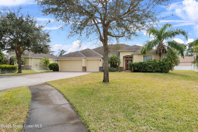 single story home featuring a garage and a front lawn