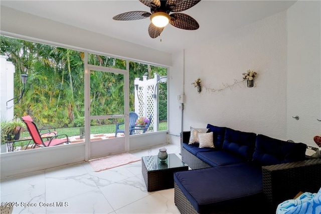 sunroom with a ceiling fan