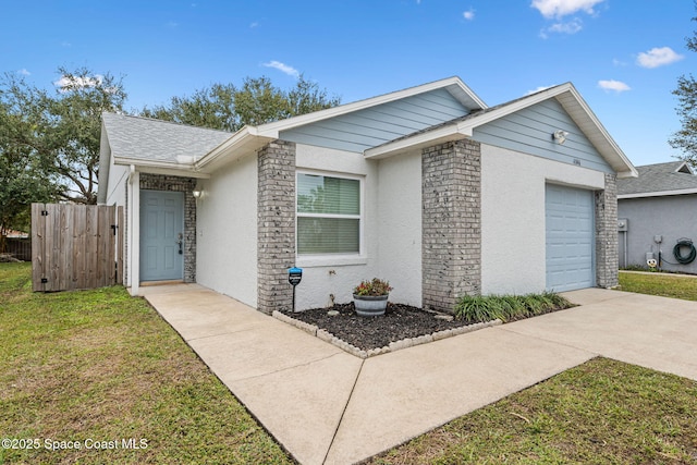 single story home with a front yard and a garage