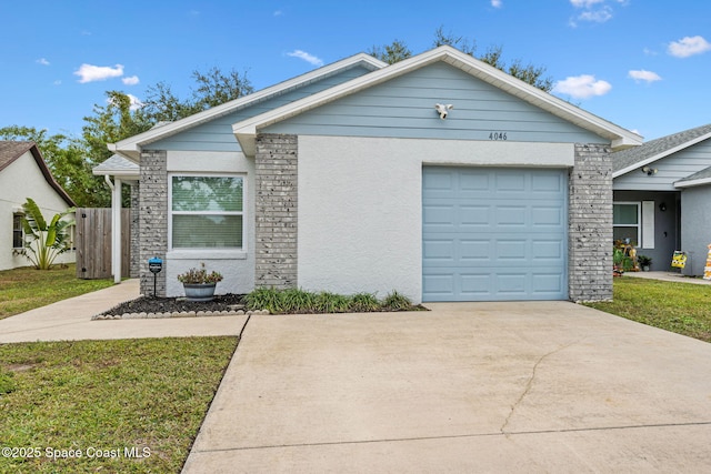 view of front facade featuring a front yard and a garage