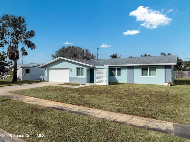 single story home featuring a garage and a front yard