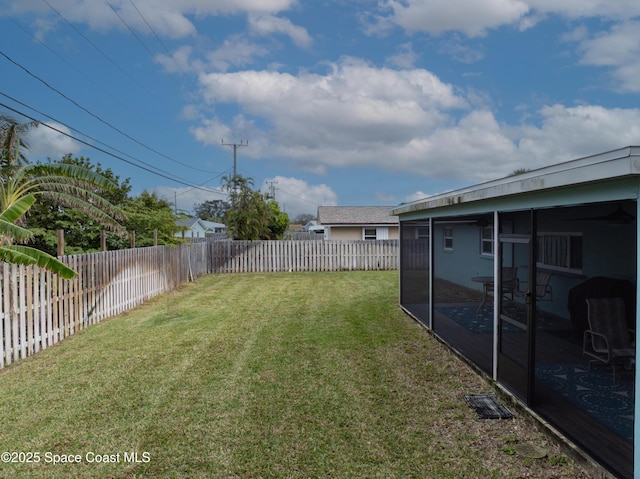 view of yard with a sunroom