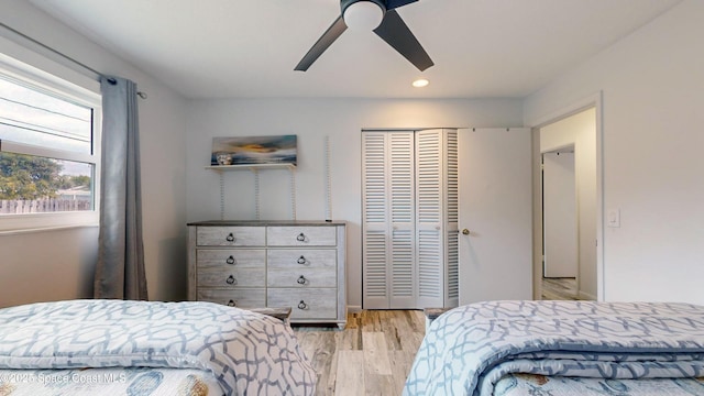 bedroom with ceiling fan and light hardwood / wood-style flooring