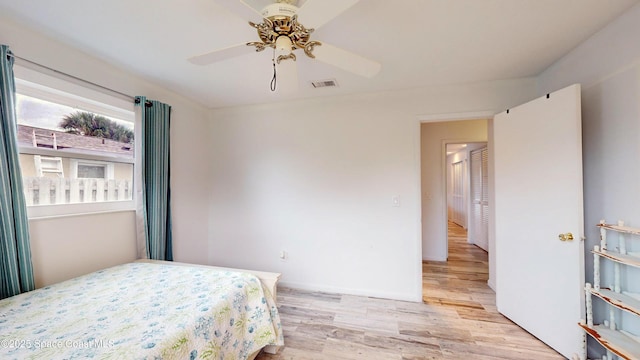 bedroom featuring ceiling fan and light hardwood / wood-style floors