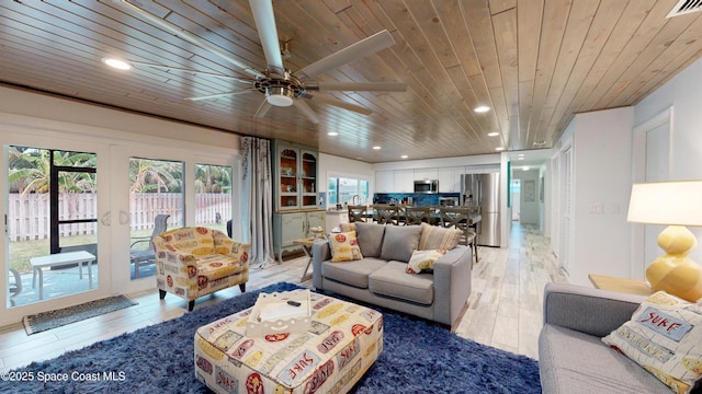 living room featuring hardwood / wood-style flooring, ceiling fan, french doors, and wood ceiling