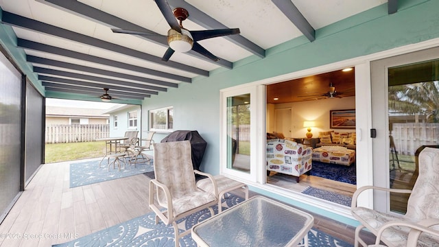 sunroom / solarium with beam ceiling