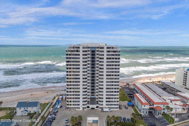 bird's eye view featuring a beach view and a water view