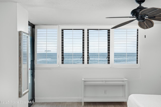 bedroom with ceiling fan and light hardwood / wood-style floors