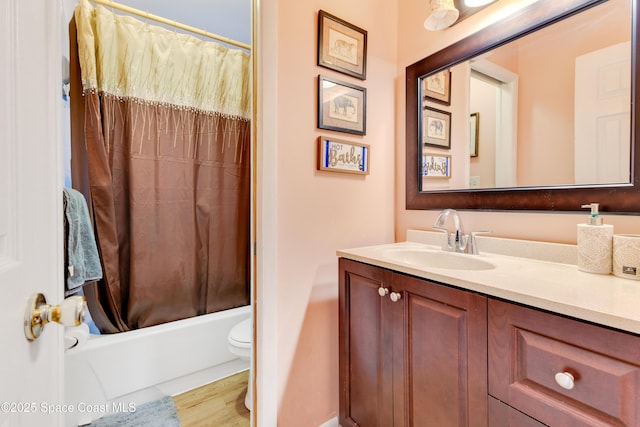 full bathroom with toilet, shower / tub combo, and vanity