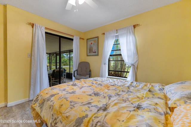 carpeted bedroom featuring ceiling fan, a textured ceiling, and access to outside